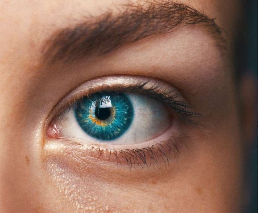 Close-up eye with blue light reflection